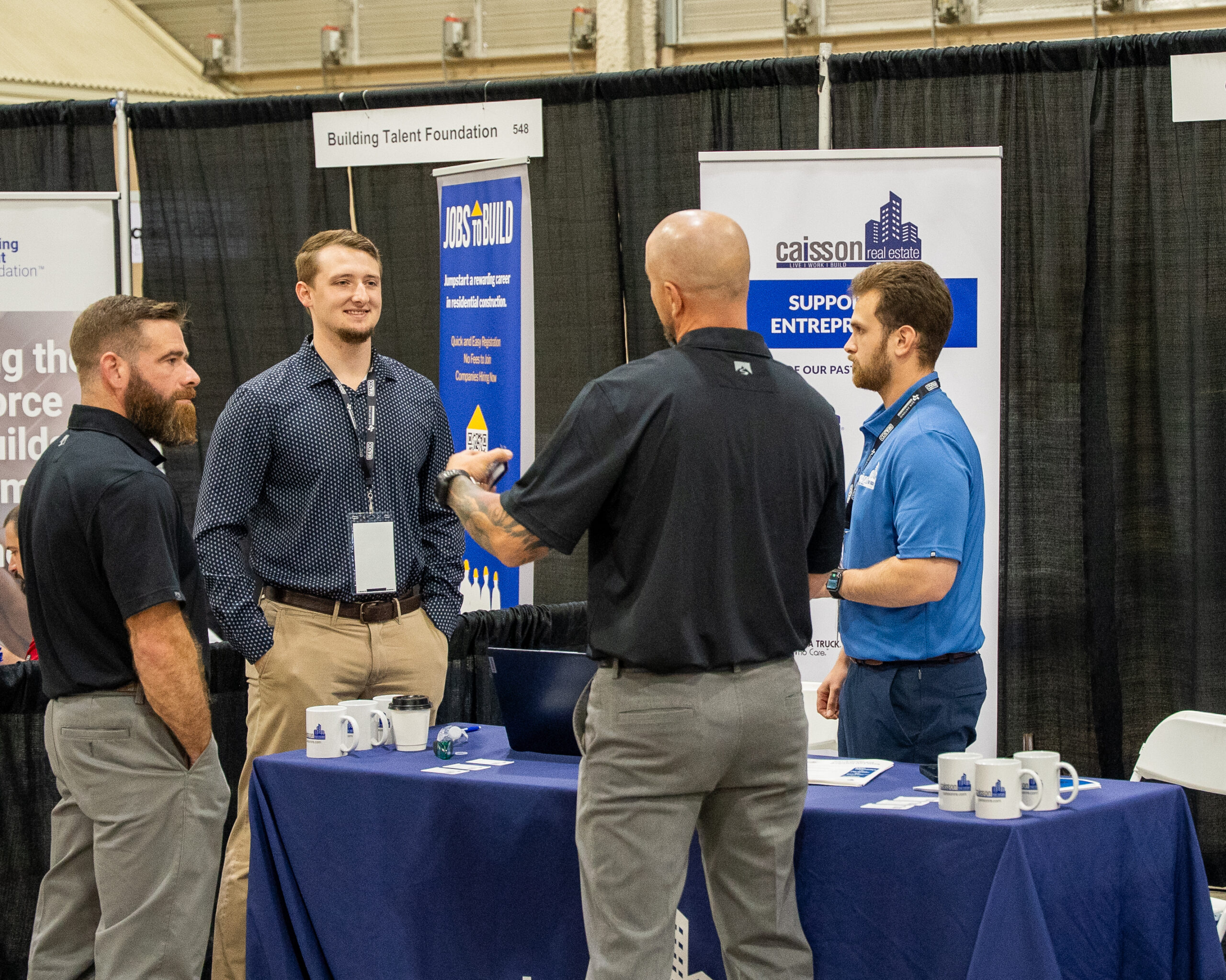 Caisson team in conversation at an industry event